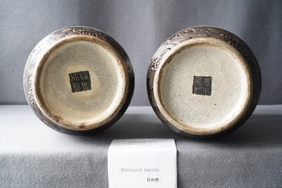 A pair of Chinese Nanking famille rose crackle-glazed 'warrior' vases, 19th C.