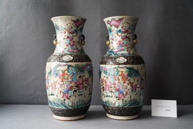 A pair of Chinese Nanking famille rose crackle-glazed 'warrior' vases, 19th C.