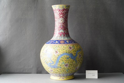 A large Chinese yellow-ground famille rose 'dragon and phoenix' bottle vase, 19th C.
