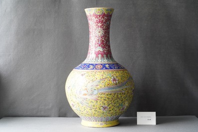 A large Chinese yellow-ground famille rose 'dragon and phoenix' bottle vase, 19th C.