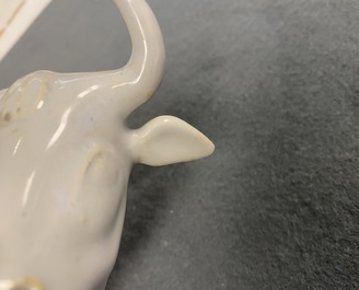 A pair of white Dutch Delftware groups of cows with milkers, 18th C.