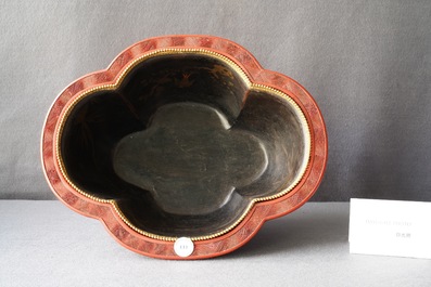 A Chinese quatrefoil jardini&egrave;re in red and black lacquer, Qianlong