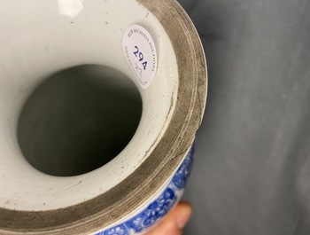 A pair of Chinese blue and white vases with floral designs, Kangxi