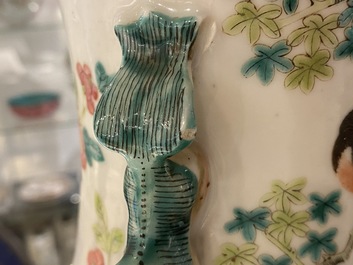 A pair of Chinese famille rose vases with birds among blossoming branches, 19th C.