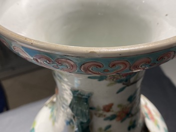 A pair of Chinese famille rose vases with birds among blossoming branches, 19th C.