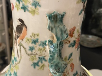 A pair of Chinese famille rose vases with birds among blossoming branches, 19th C.