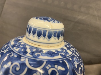 A pair of Chinese blue and white lidded jars with floral design, Kangxi