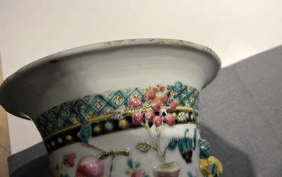 A Chinese relief-moulded famille rose 'antiquities' vase, 19th C.
