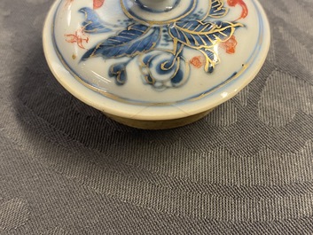 A rare Chinese blue, white, iron red and gilt tripod teapot and cover, Kangxi