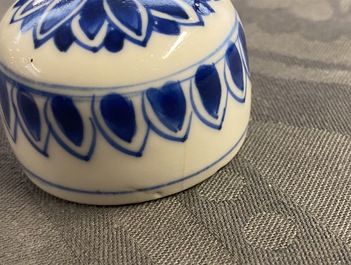 A pair of Chinese blue and white lidded jars with floral design, Kangxi