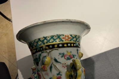 A Chinese relief-moulded famille rose 'antiquities' vase, 19th C.