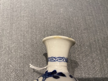 Four Chinese blue and white miniature vases and a huqqa base, Kangxi