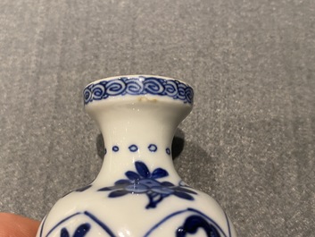 Four Chinese blue and white miniature vases and a huqqa base, Kangxi