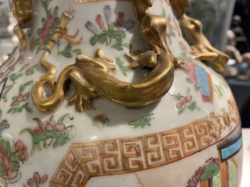A pair of Chinese Canton famille rose vases, 19th C.