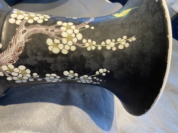 A Chinese famille noire 'magpie and prunus' yenyen vase, Kangxi