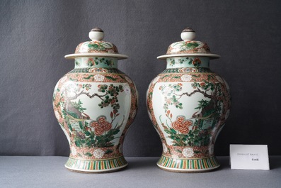 A pair of Chinese famille verte vases and covers, Kangxi mark, 19th C.
