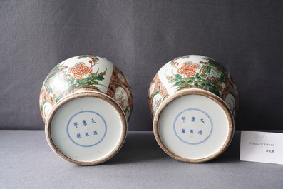 A pair of Chinese famille verte vases and covers, Kangxi mark, 19th C.