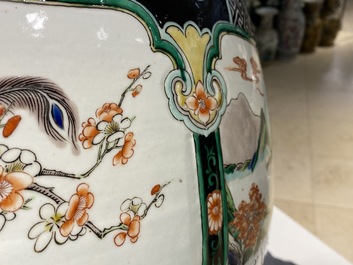 A large Chinese famille verte relief-moulded fish bowl, 19th C.