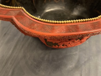 A Chinese quatrefoil jardini&egrave;re in red and black lacquer, Qianlong