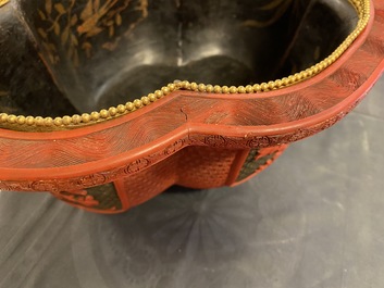 A Chinese quatrefoil jardini&egrave;re in red and black lacquer, Qianlong