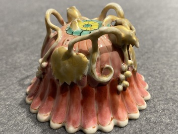 A Chinese famille rose cup and saucer and a 'magnolia' cup, Yongzheng