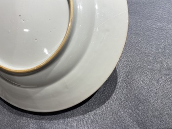 Deux assiettes en porcelaine de Chine en rouge de fer et dor&eacute; &agrave; d&eacute;cor du 'bapt&ecirc;me', Kangxi