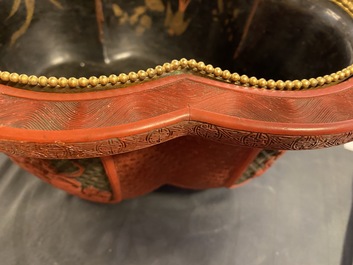 A Chinese quatrefoil jardini&egrave;re in red and black lacquer, Qianlong