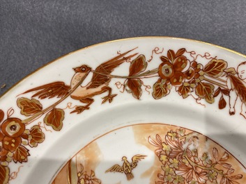 Deux assiettes en porcelaine de Chine en rouge de fer et dor&eacute; &agrave; d&eacute;cor du 'bapt&ecirc;me', Kangxi