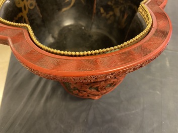 A Chinese quatrefoil jardini&egrave;re in red and black lacquer, Qianlong