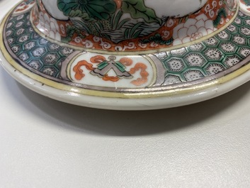 A pair of Chinese famille verte vases and covers, Kangxi mark, 19th C.