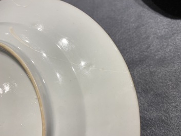 Deux assiettes en porcelaine de Chine en rouge de fer et dor&eacute; &agrave; d&eacute;cor du 'bapt&ecirc;me', Kangxi