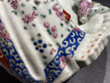 A Chinese blue and white 'dragon' dish and a famille rose figure of Buddha, 19th C.