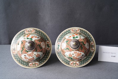 A pair of Chinese famille verte vases and covers, Kangxi mark, 19th C.