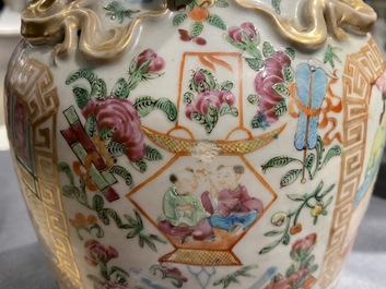 A pair of Chinese Canton famille rose vases and a single vase, 19th C.