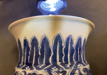 A Chinese blue and white 'lotus scroll' spittoon or zhadou, Kangxi