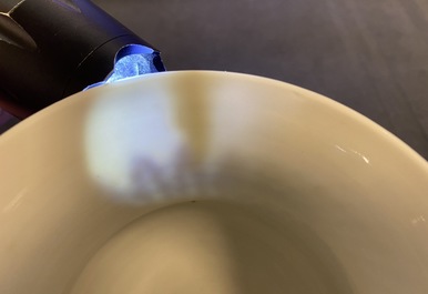 A Chinese blue and white 'lotus scroll' spittoon or zhadou, Kangxi