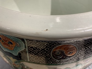A large Chinese famille verte relief-moulded fish bowl, 19th C.
