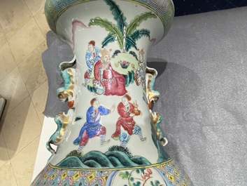 A Chinese famille rose vase with figures in a landscape, 19th C.