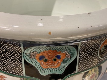A large Chinese famille verte relief-moulded fish bowl, 19th C.
