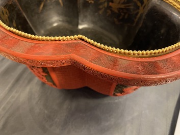A Chinese quatrefoil jardini&egrave;re in red and black lacquer, Qianlong