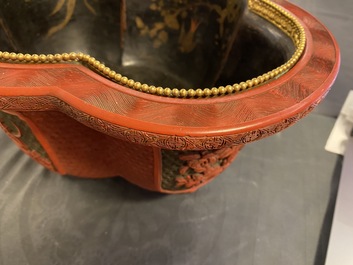 A Chinese quatrefoil jardini&egrave;re in red and black lacquer, Qianlong