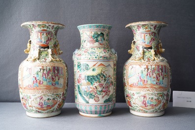A pair of Chinese Canton famille rose vases and a single vase, 19th C.