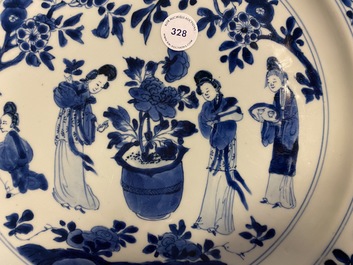 A Chinese blue and white dish with ladies around a jardini&egrave;re, Kangxi