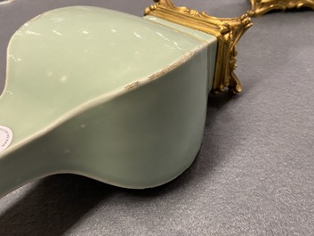 A pair of Chinese monochrome celadon vases with gilt bronze mounts, 18/19th C.