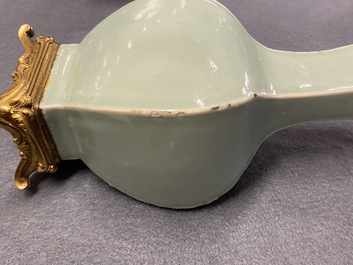 A pair of Chinese monochrome celadon vases with gilt bronze mounts, 18/19th C.