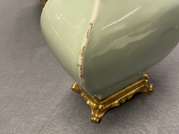 A pair of Chinese monochrome celadon vases with gilt bronze mounts, 18/19th C.