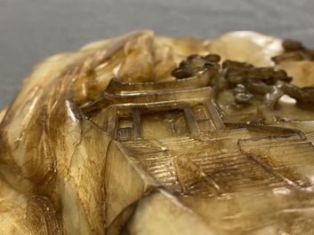 A Chinese mottled white jade mountain landscape with a fishing boat, Qing