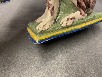 A pair of polychrome Dutch Delft money banks modelled as dogs, 18th C.