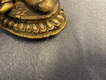 Two Sino-Tibetan gilt bronze figures, 19th C.