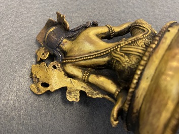 Two Sino-Tibetan gilt bronze figures, 19th C.